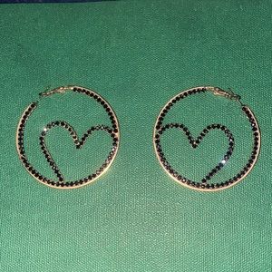 Gold tone hoop and heart earrings with black rhinestones